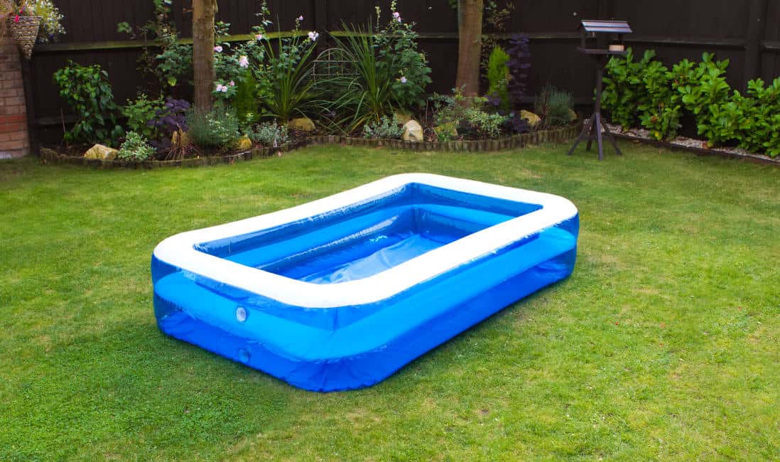 an inflatable swimming pool in an english garden