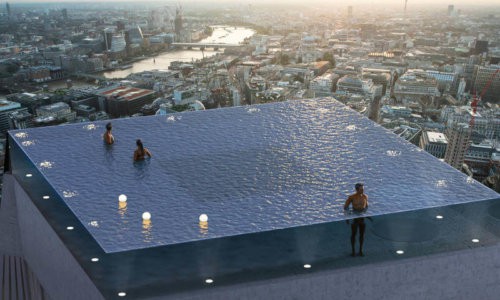 Rooftop infinity pool in London with panoramic views over the London skyline at sunset.
