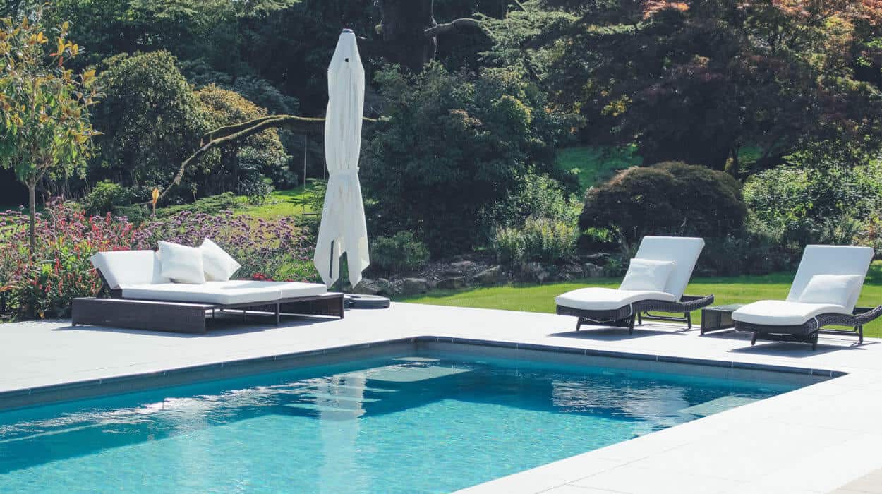 Loungers and Parasol by Pool