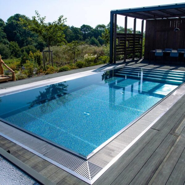 Outdoor pool by woodland