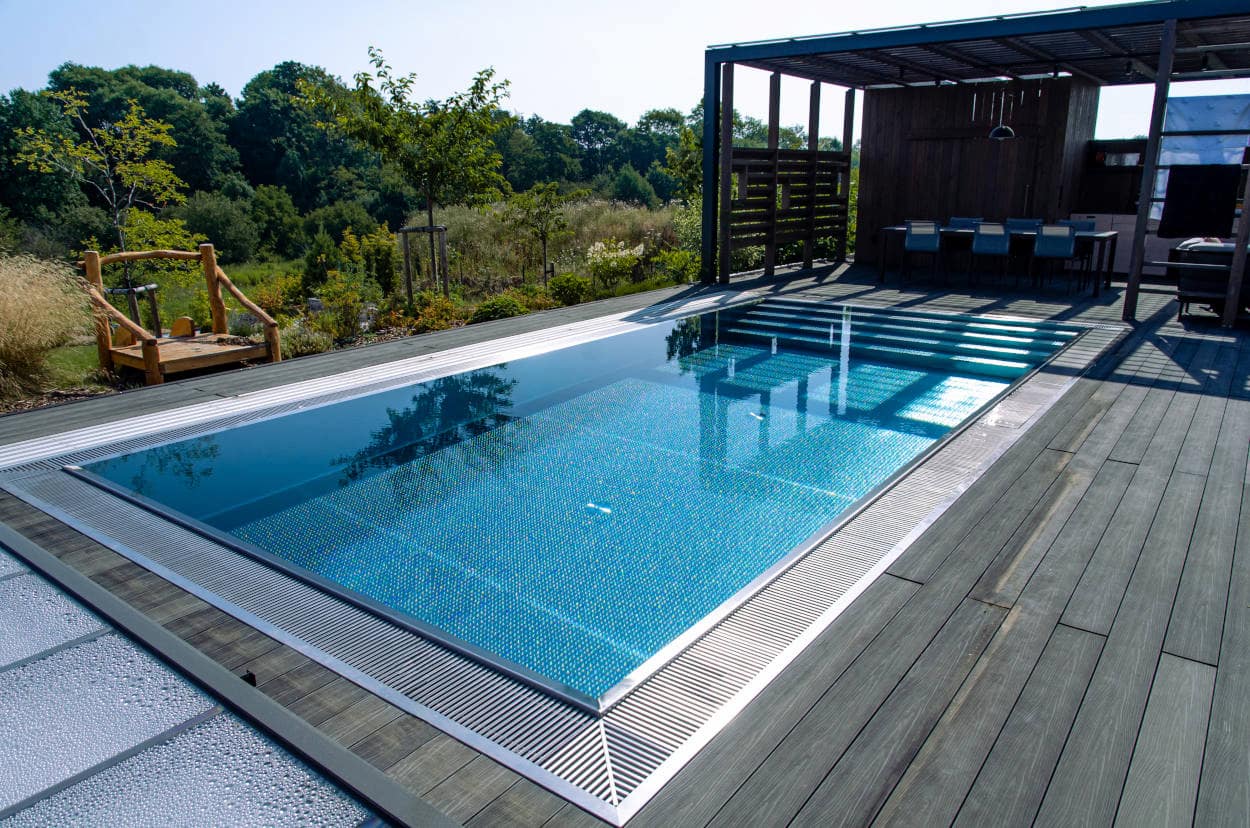 Outdoor pool by woodland